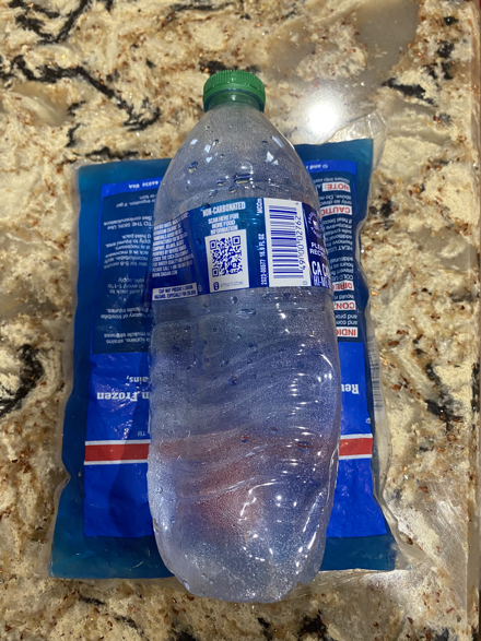 Plastic bottle beginning to crush on ice pack
